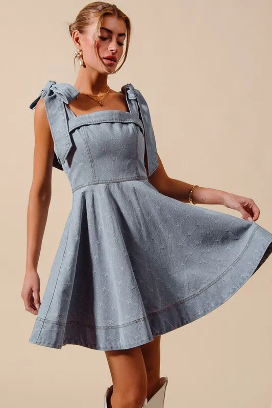 A-Line Fit and Flare Diamond Bow Ribbon Denim Dress with Tied Bow.