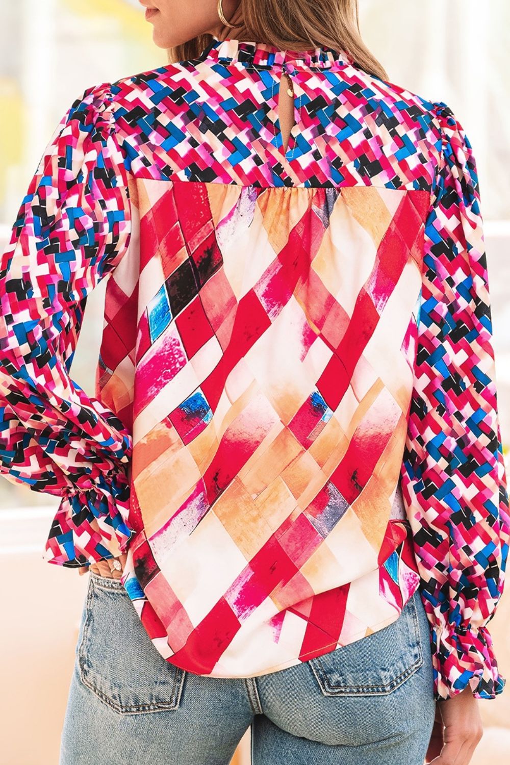 Abstract geometric pattern flounce sleeve blouse.