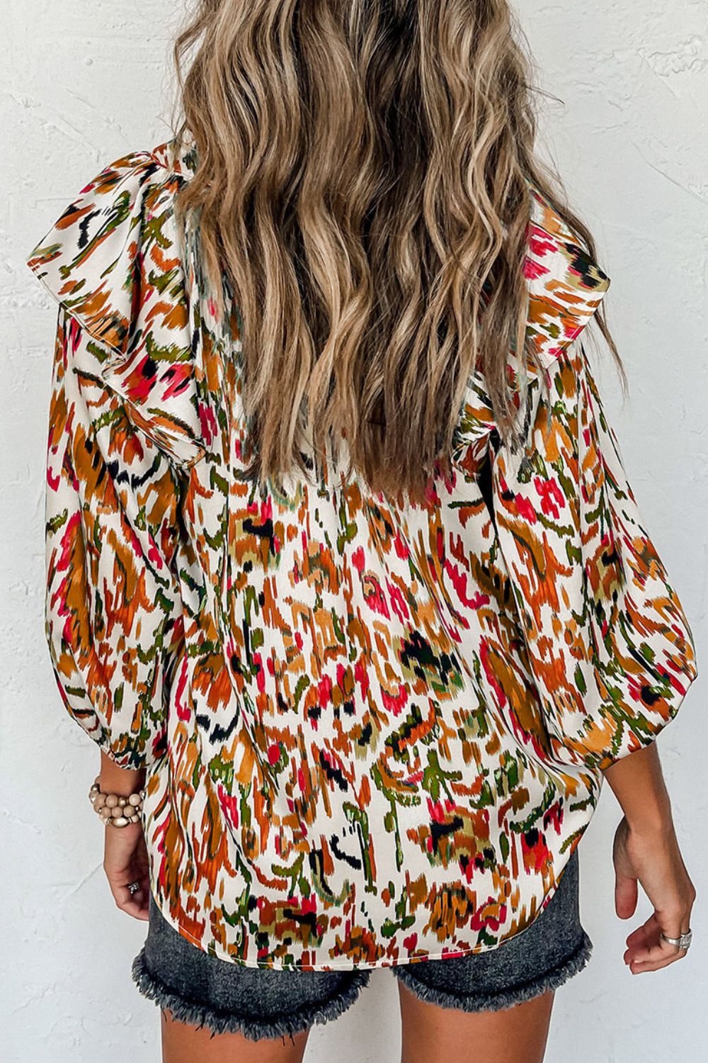 Abstract print 3/4 sleeve ruffle blouse.