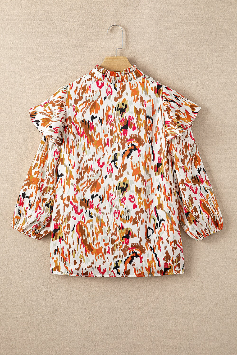 Abstract print 3/4 sleeve ruffle blouse.