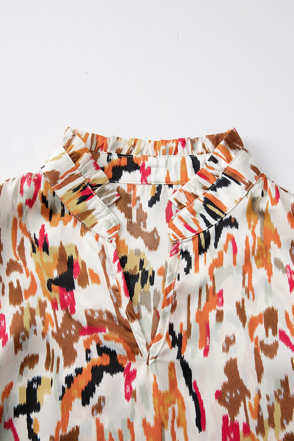 Abstract print 3/4 sleeve ruffle blouse.