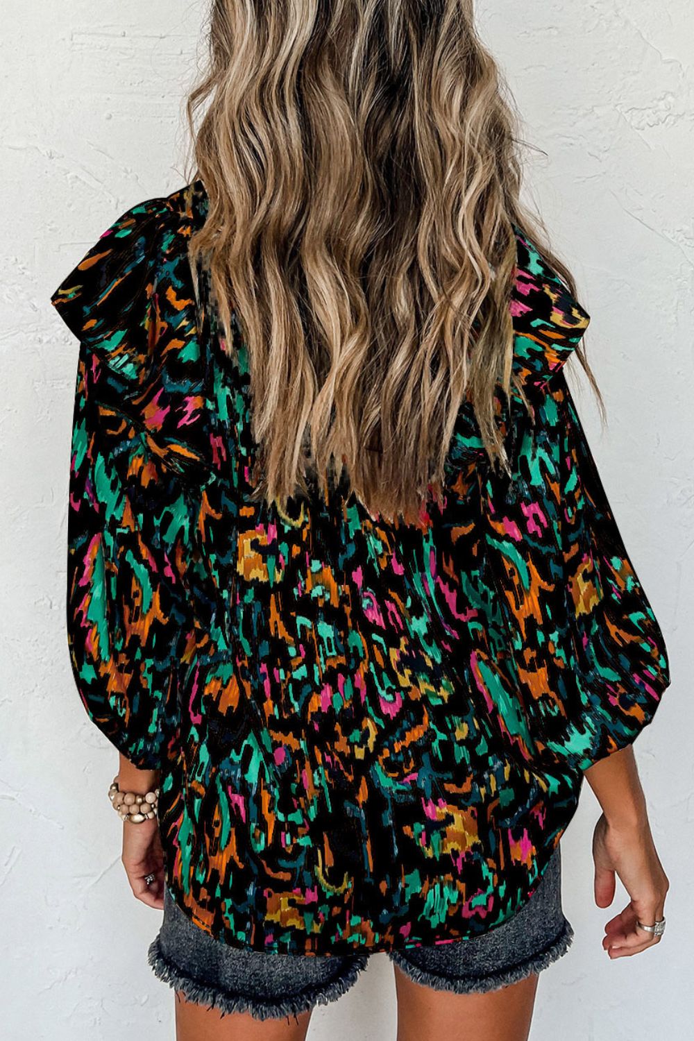 Abstract print 3/4 sleeve ruffle blouse.