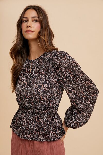 Annie Wear abstract print balloon sleeve peplum blouse.