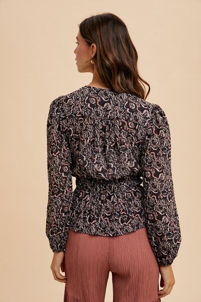 Annie Wear abstract print balloon sleeve peplum blouse.