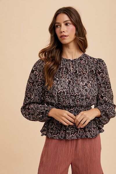 Annie Wear abstract print balloon sleeve peplum blouse.