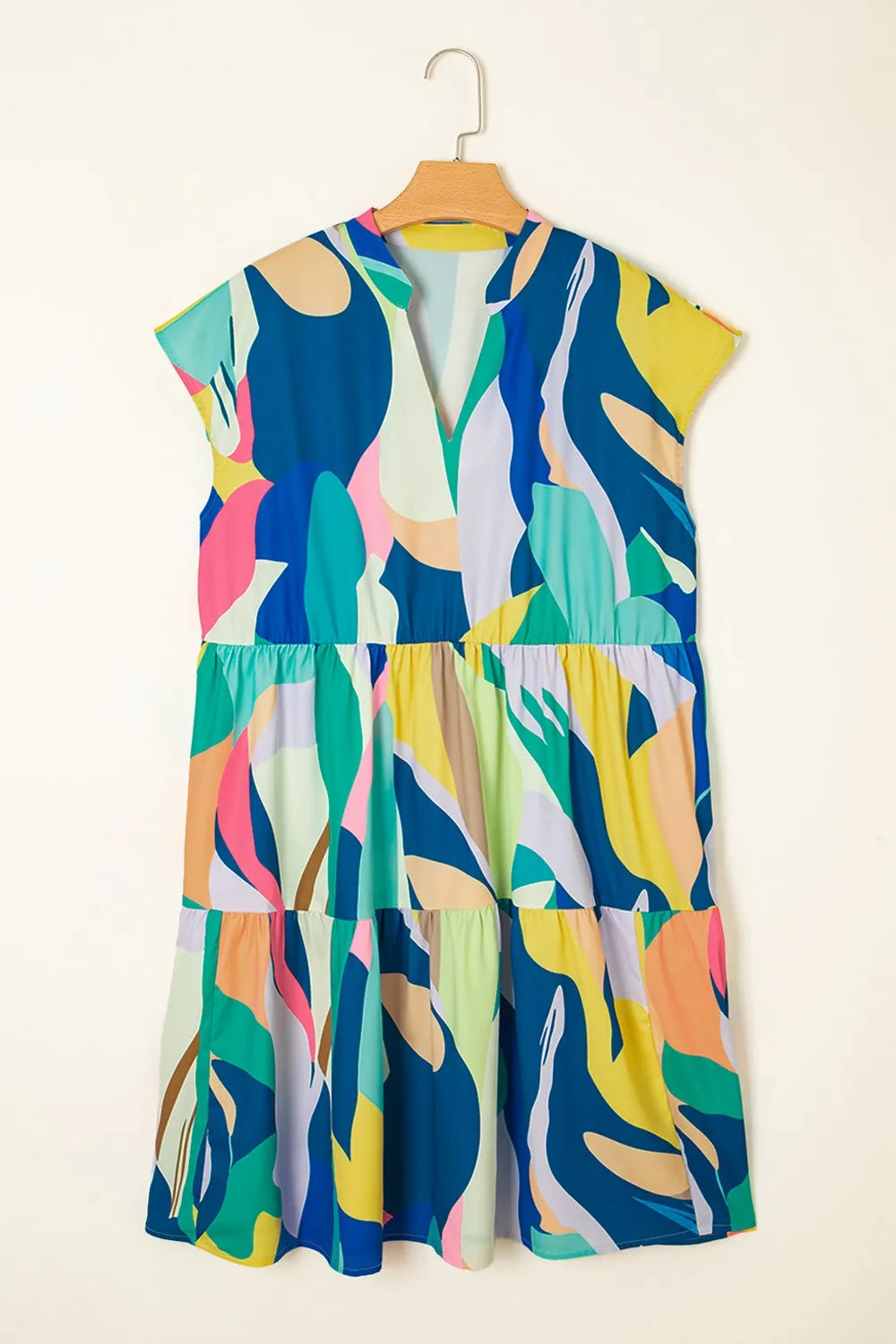 Abstract Print Cap Sleeve Pocketed Mini Dress with Tiered Skirt.