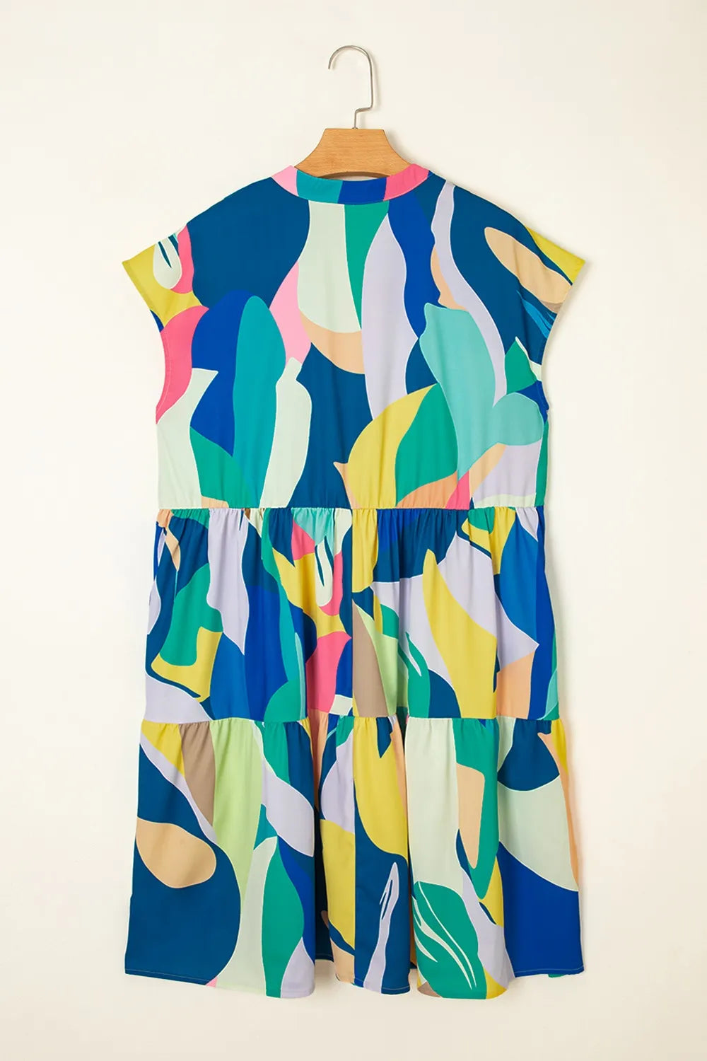 Abstract Print Cap Sleeve Pocketed Mini Dress with Tiered Skirt.