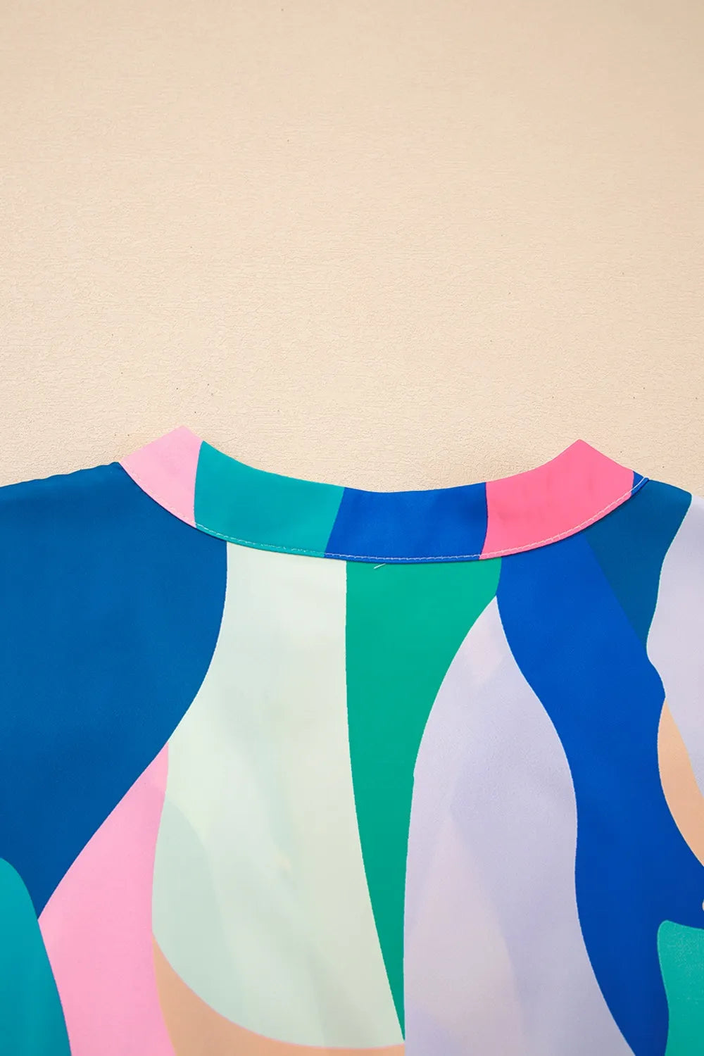 Abstract Print Cap Sleeve Pocketed Mini Dress with Tiered Skirt.