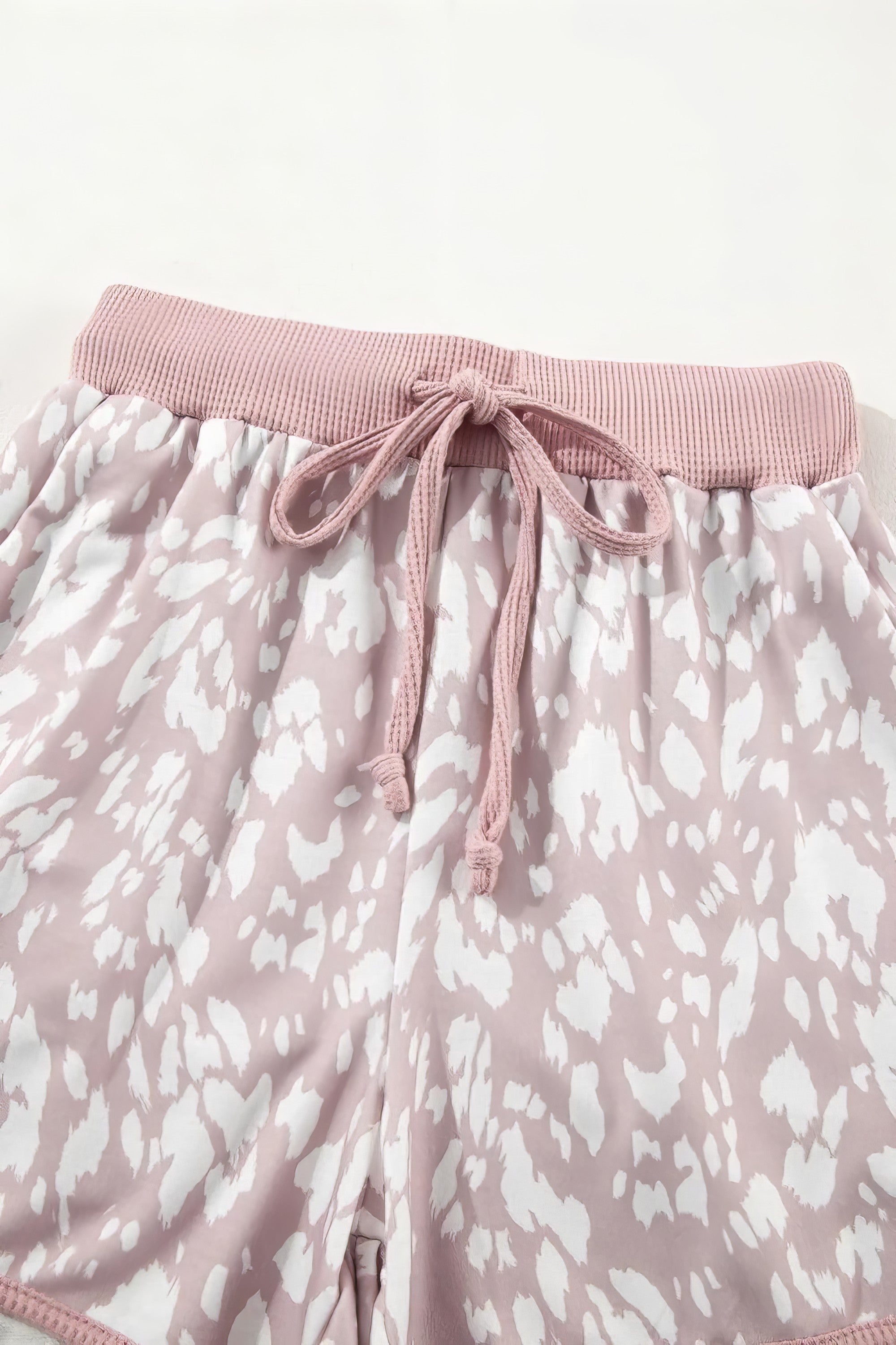 Women's abstract print casual shorts with drawstring waist.