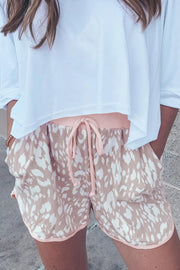 Women's abstract print casual shorts with drawstring waist.
