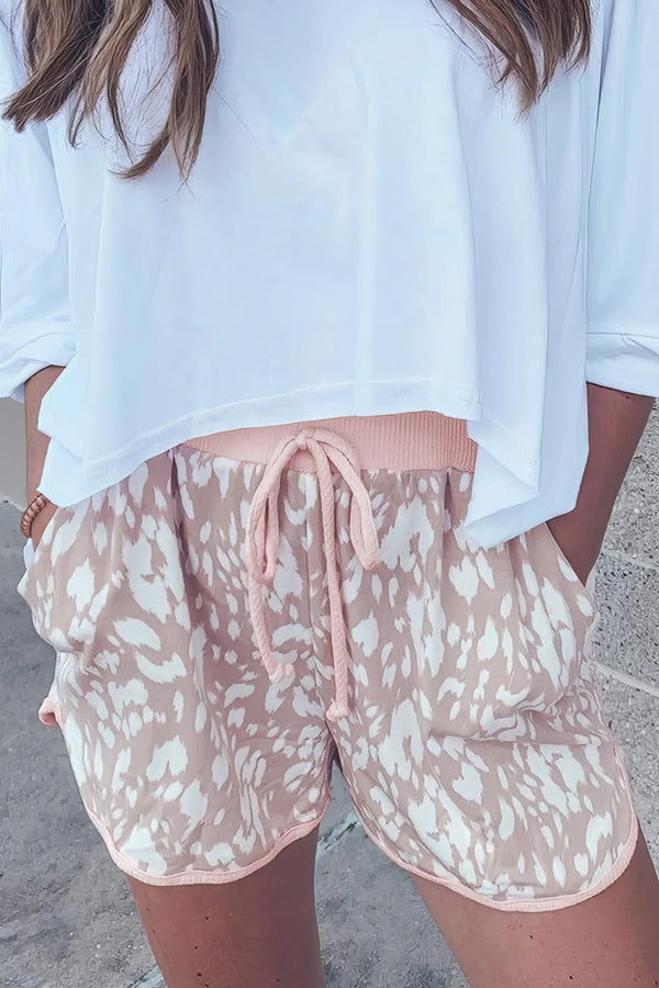 Women's abstract print casual shorts with drawstring waist.