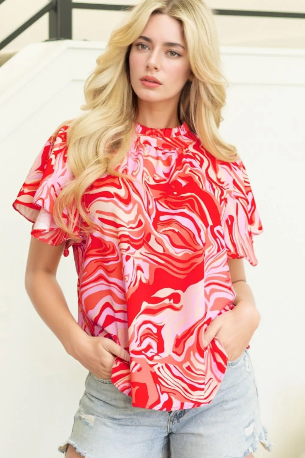 Abstract Print Ruffled Short Sleeve Mock Neck Blouse.