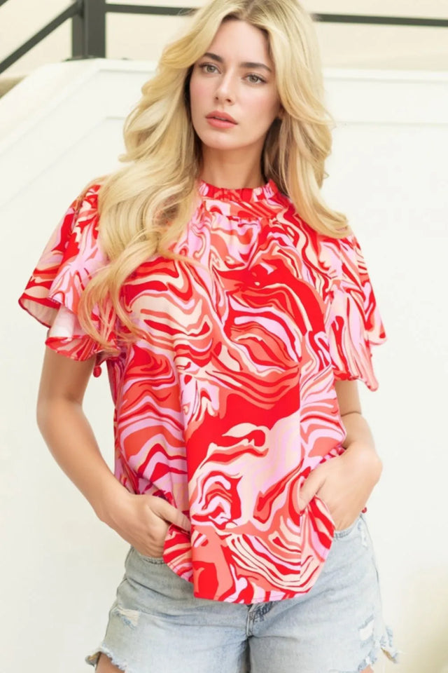 Abstract Print Ruffled Short Sleeve Mock Neck Blouse.