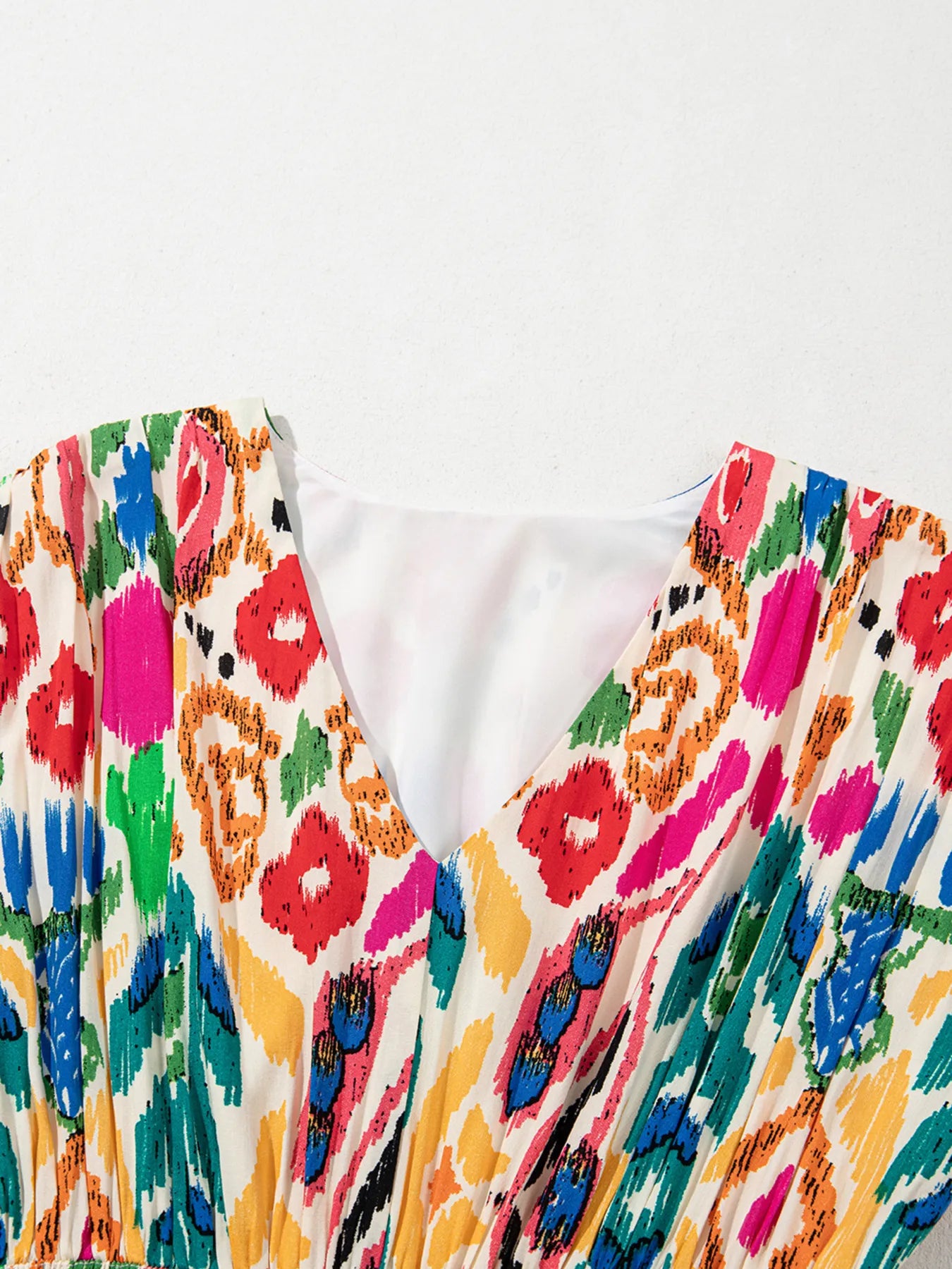 Abstract Print V Neck Dolman Sleeve Ruffle Tiered Mini Dress.