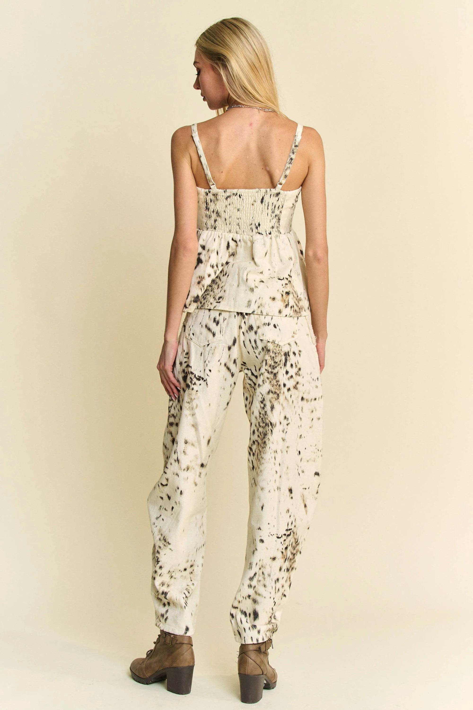 Abstract tie-dye dot lace detail barrel pants with pockets on a cream background.