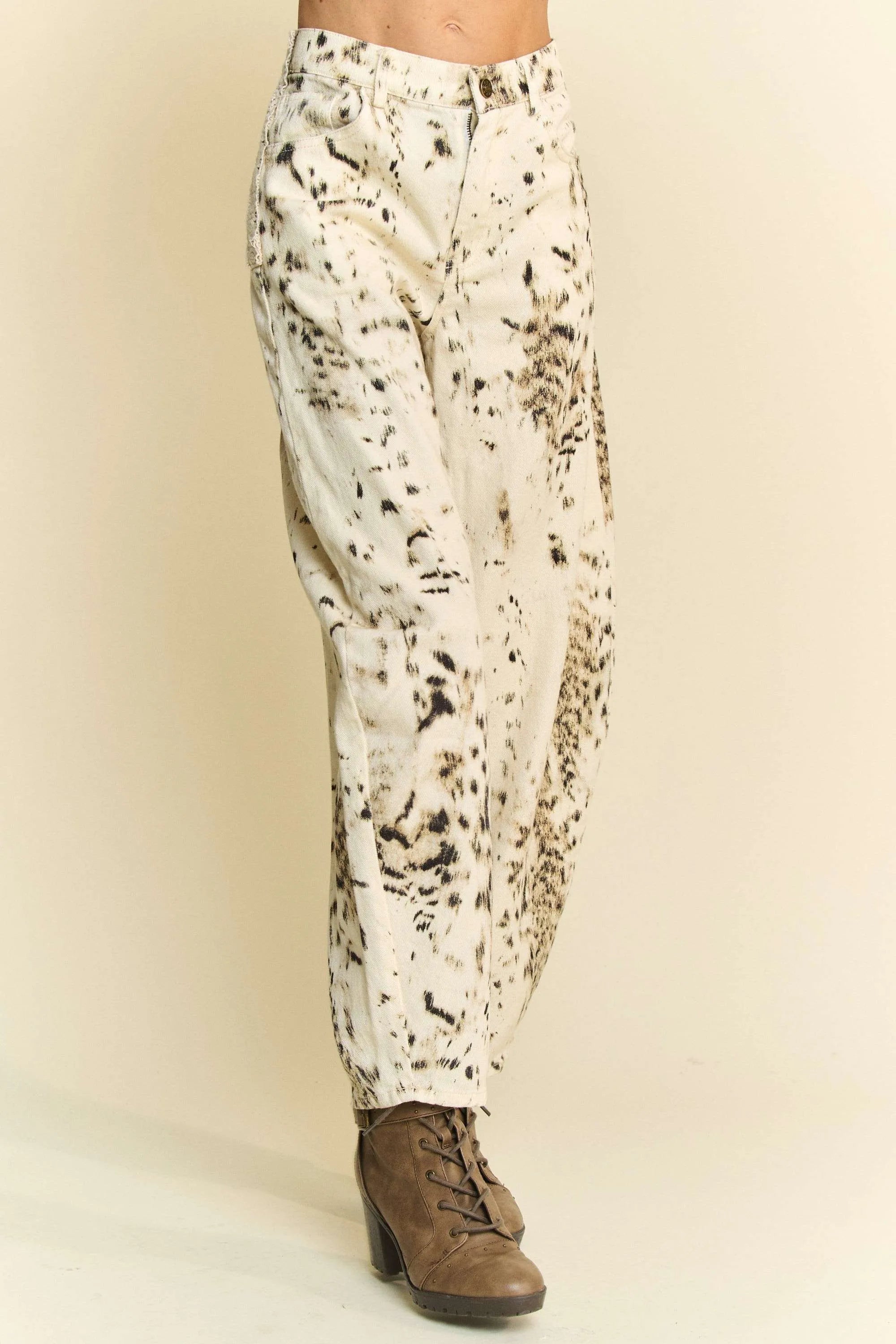 Abstract tie-dye dot lace detail barrel pants with pockets on a cream background.