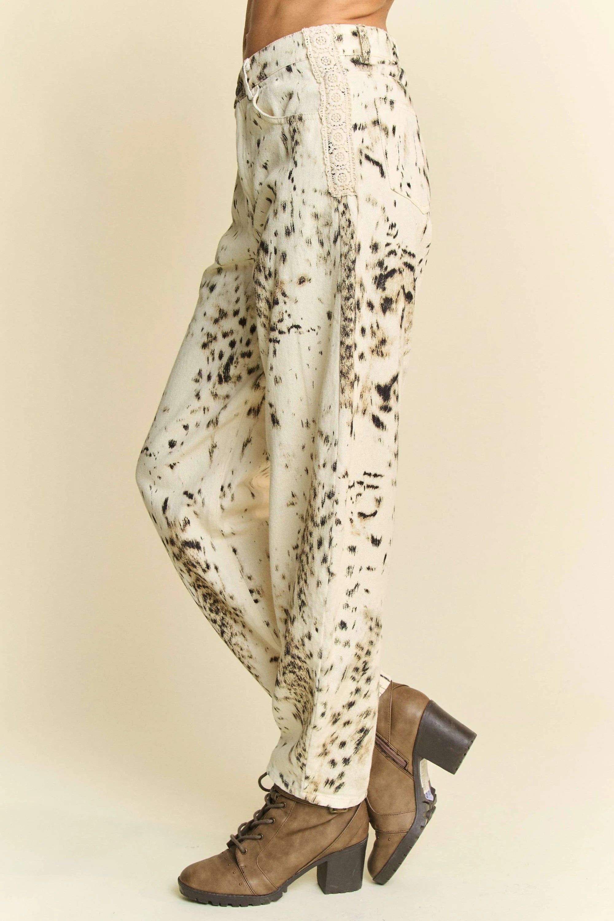 Abstract tie-dye dot lace detail barrel pants with pockets on a cream background.