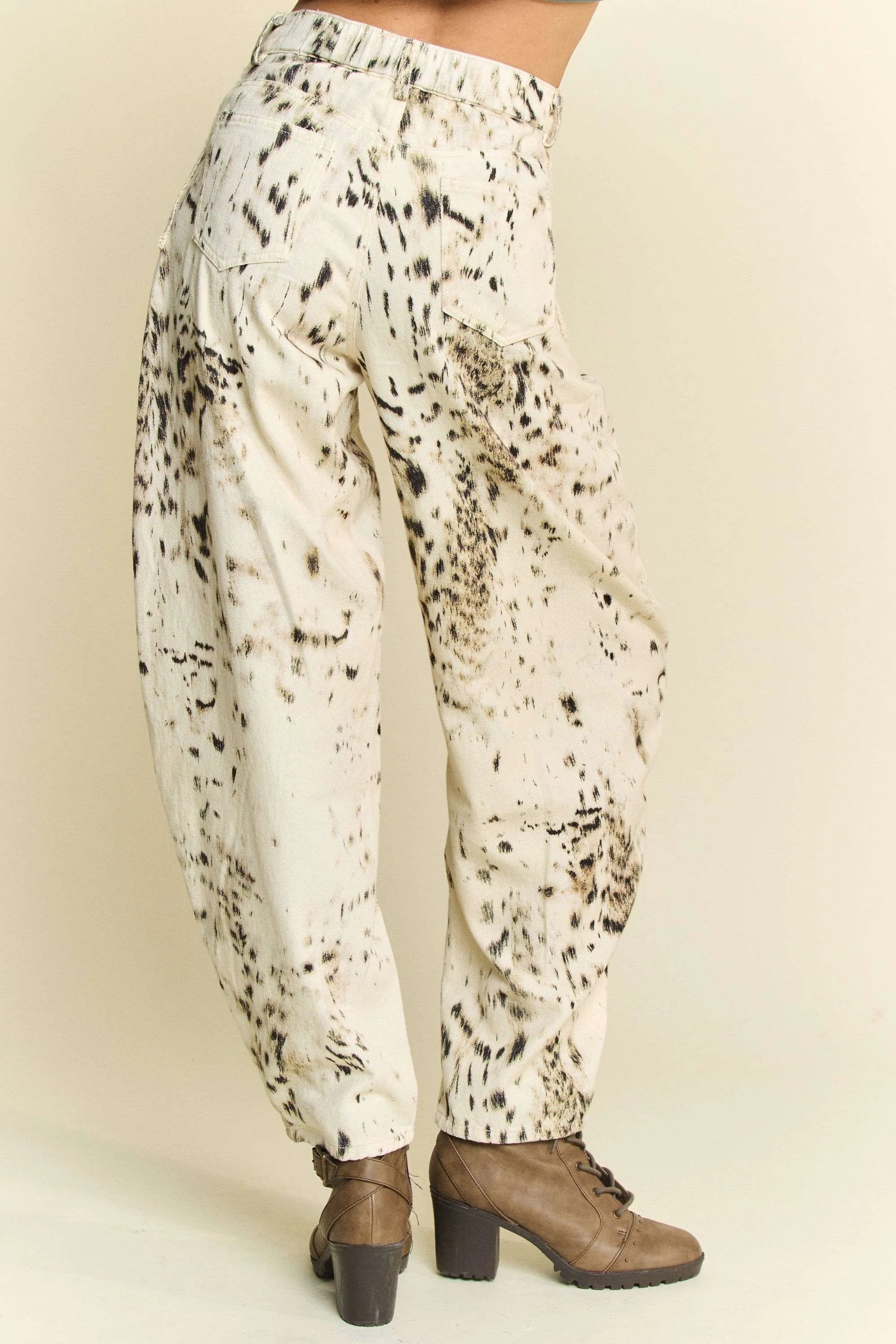 Abstract tie-dye dot lace detail barrel pants with pockets on a cream background.