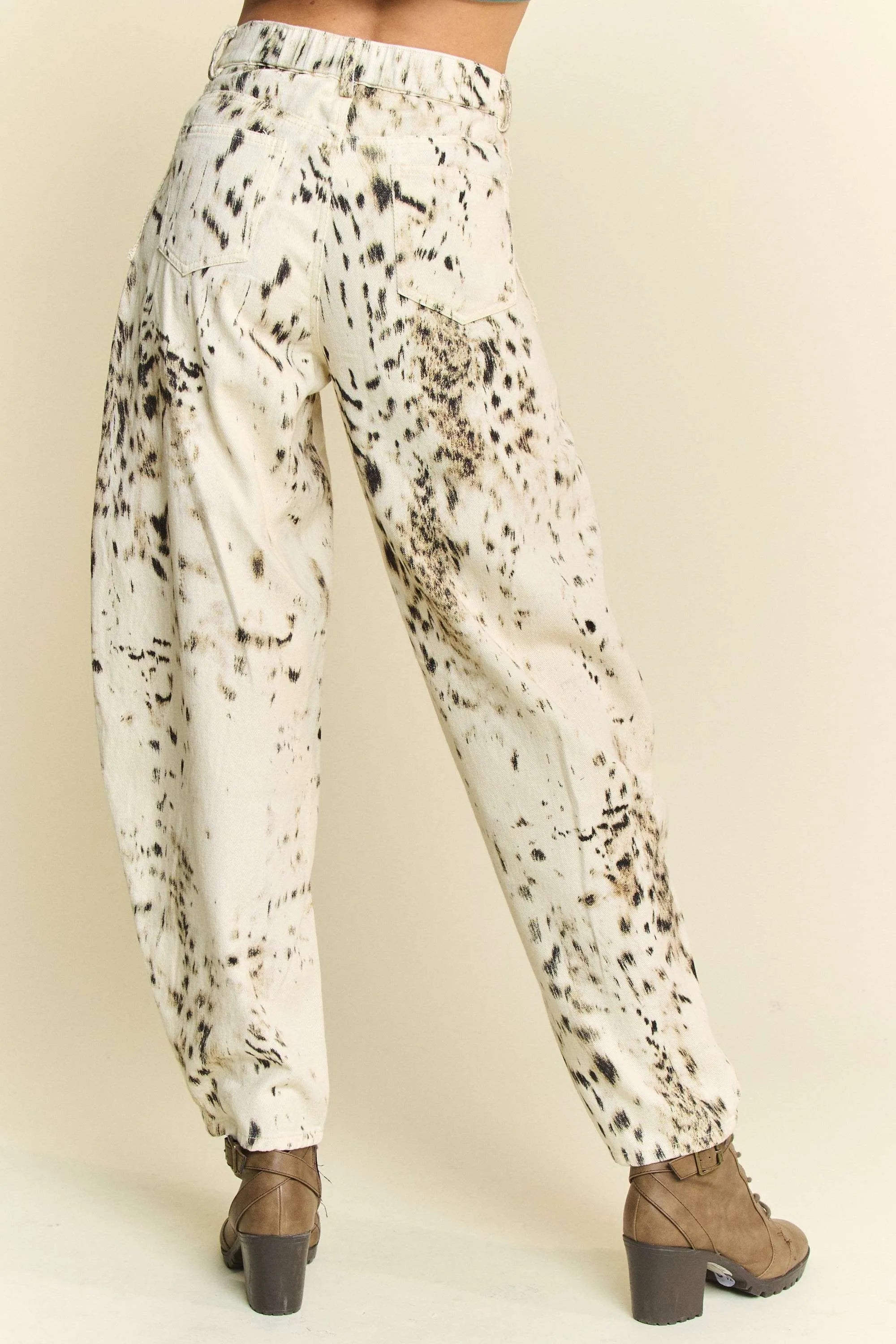 Abstract tie-dye dot lace detail barrel pants with pockets on a cream background.
