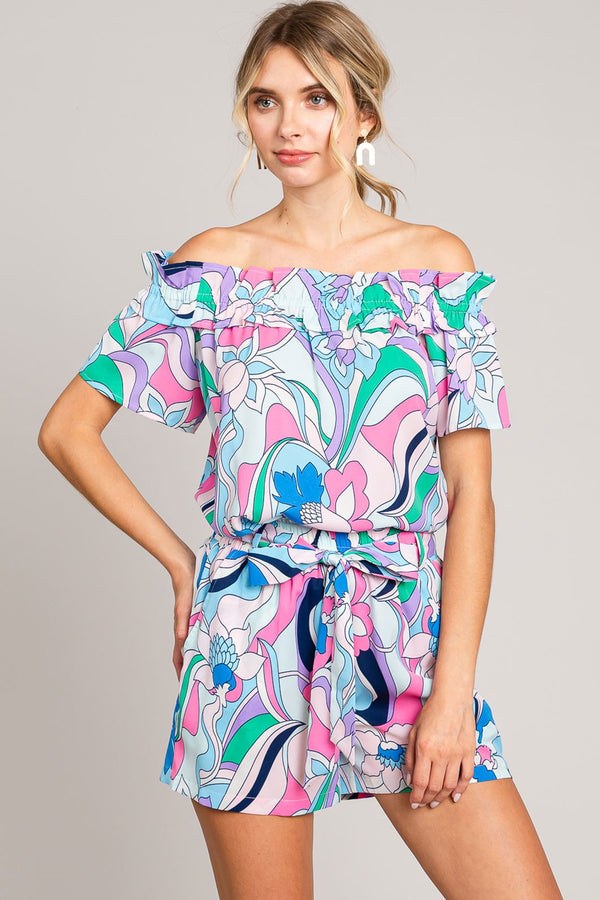 Abstract print tie-front shorts with pockets and ruched detail.