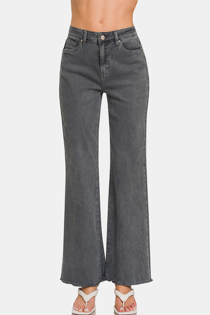Acid washed frayed hem bootcut jeans with pockets and slight stretch.