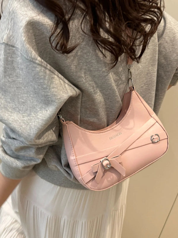 Small PU leather shoulder bag with an adjustable strap.