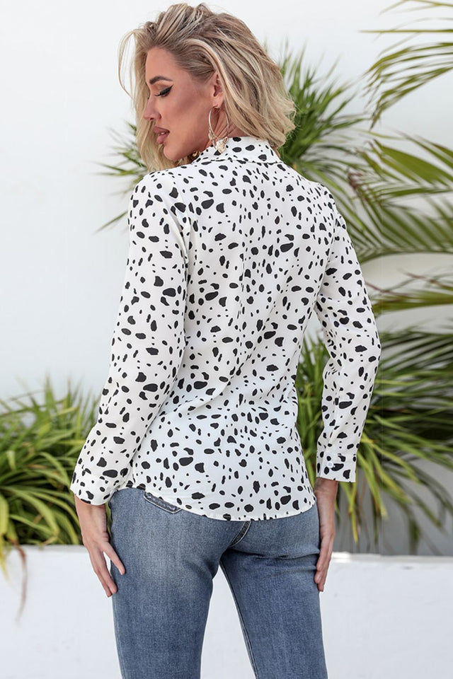 Animal print curved hem button-up shirt.
