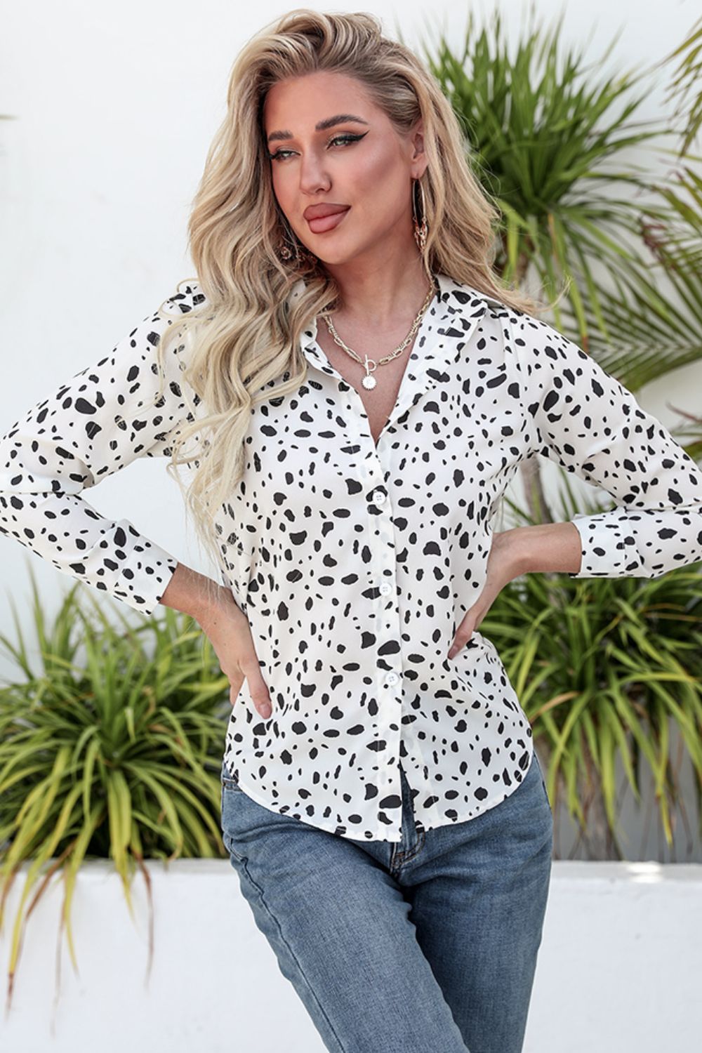 Animal print curved hem button-up shirt.