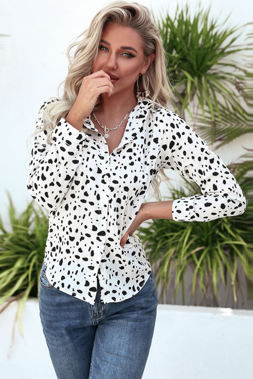 Animal print curved hem button-up shirt.