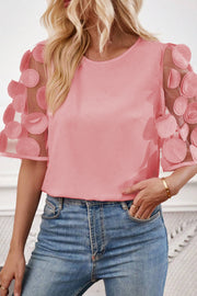 Applique round neck half sleeve blouse.