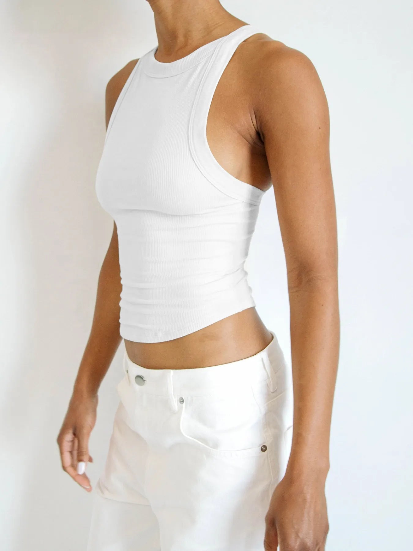 Asymmetrical back ribbed crop tank top.