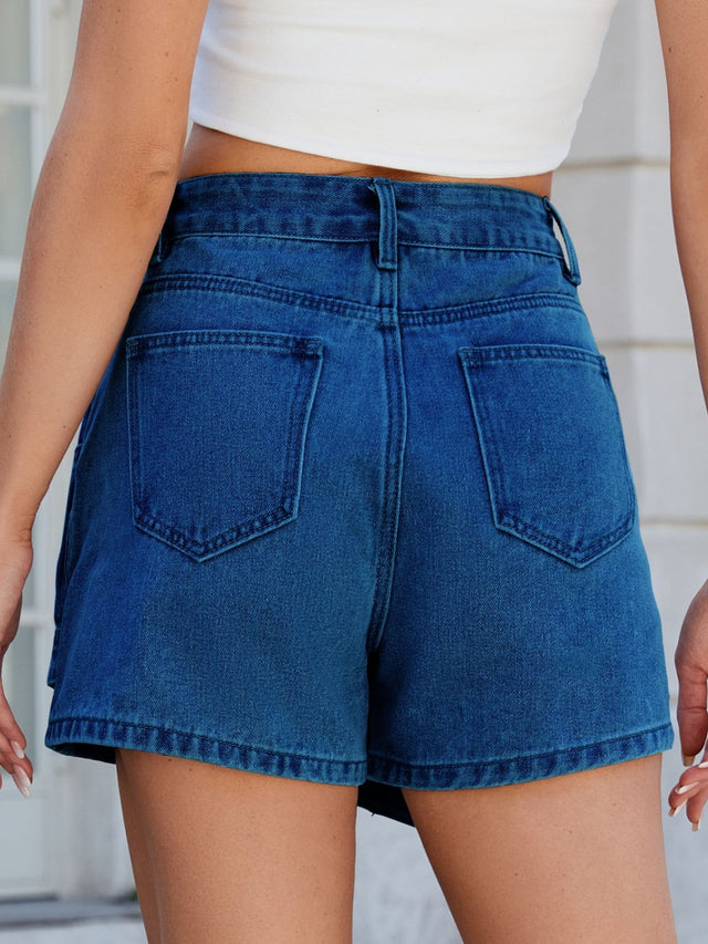Asymmetrical denim skort with pockets.