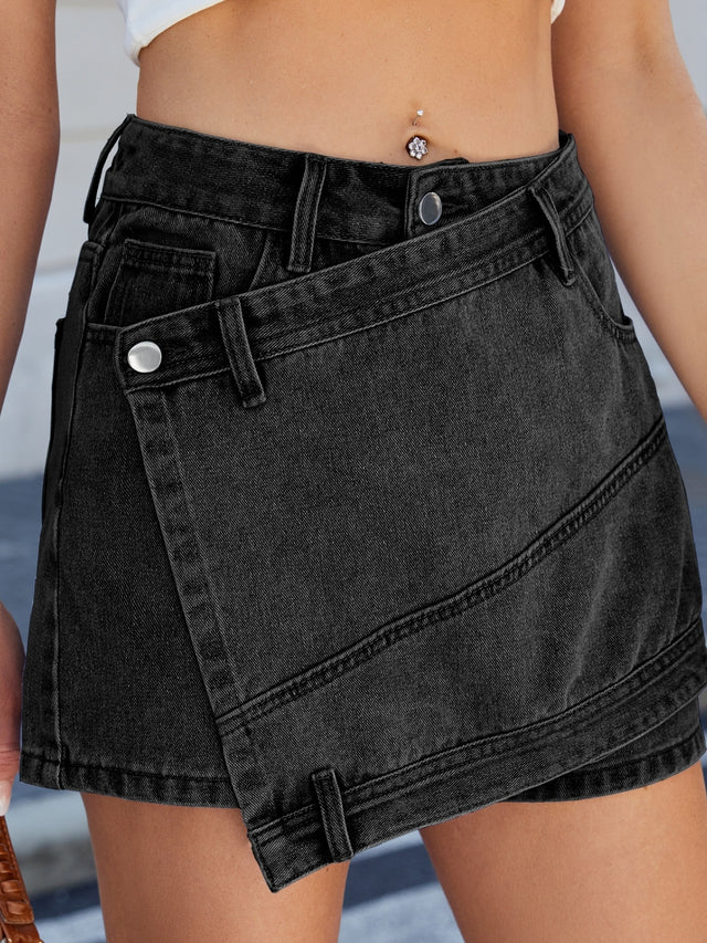 Asymmetrical denim skort with pockets.