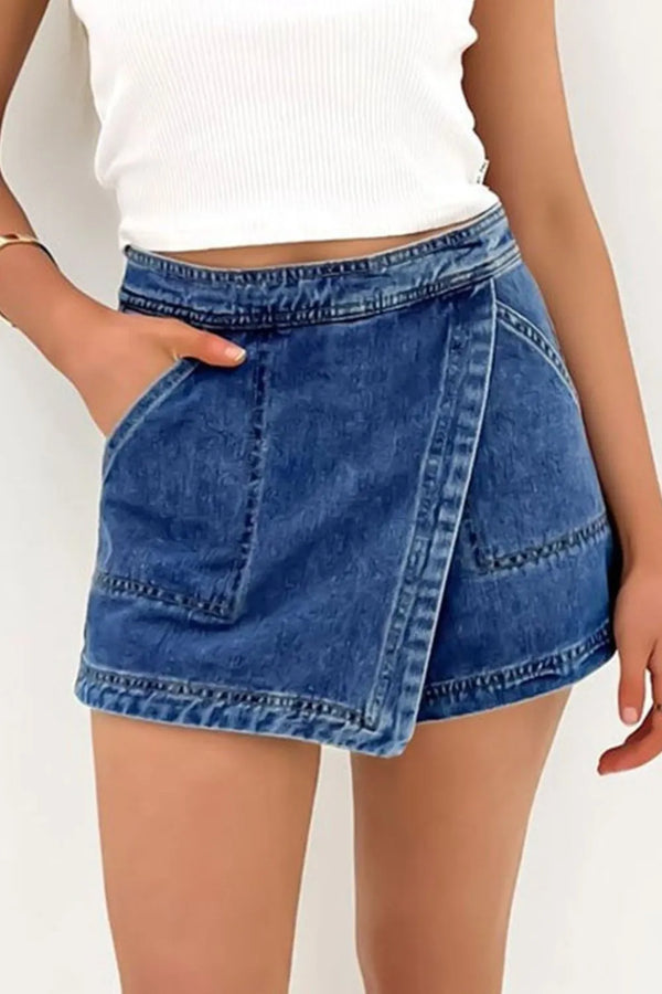 Asymmetrical denim skort with pockets.