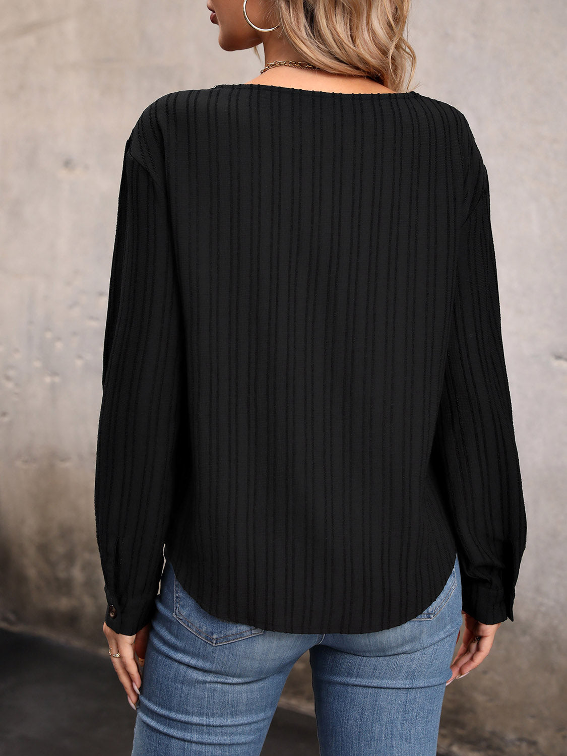 Perfee asymmetrical neck decorative button top.