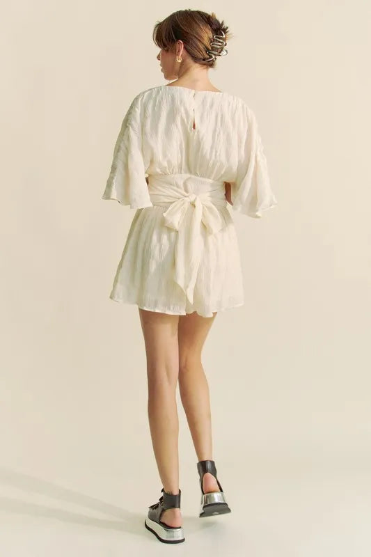 Batwing Sleeve Waist Belt Romper with Ruched and Ruffled Details.