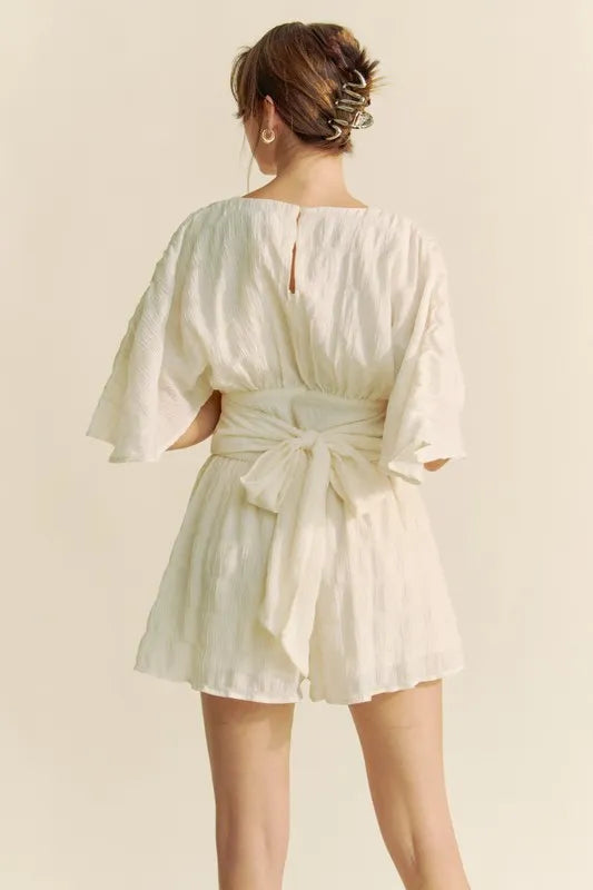 Batwing Sleeve Waist Belt Romper with Ruched and Ruffled Details.