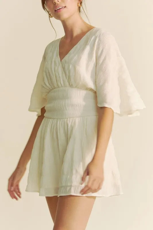 Batwing Sleeve Waist Belt Romper with Ruched and Ruffled Details.