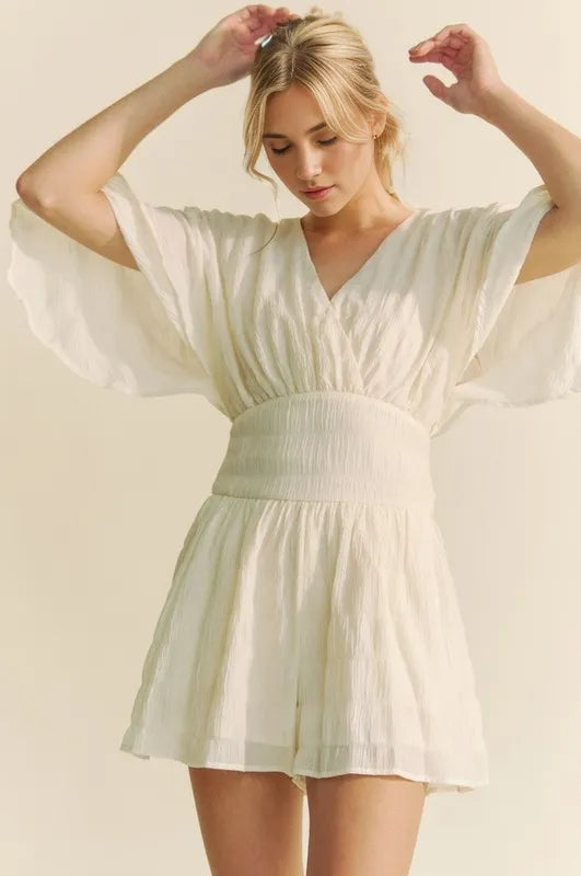 Batwing Sleeve Waist Belt Romper with Ruched and Ruffled Details.