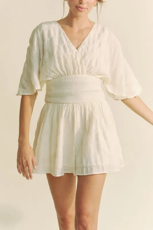 Batwing Sleeve Waist Belt Romper with Ruched and Ruffled Details.