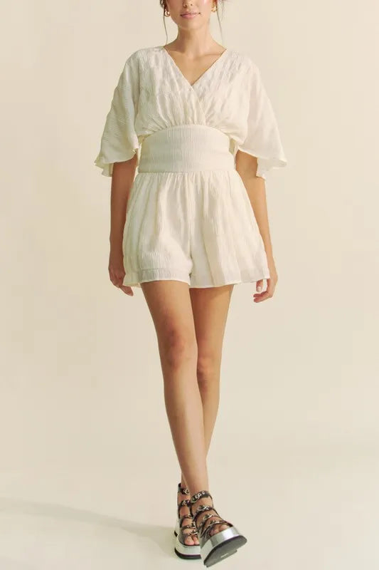 Batwing Sleeve Waist Belt Romper with Ruched and Ruffled Details.
