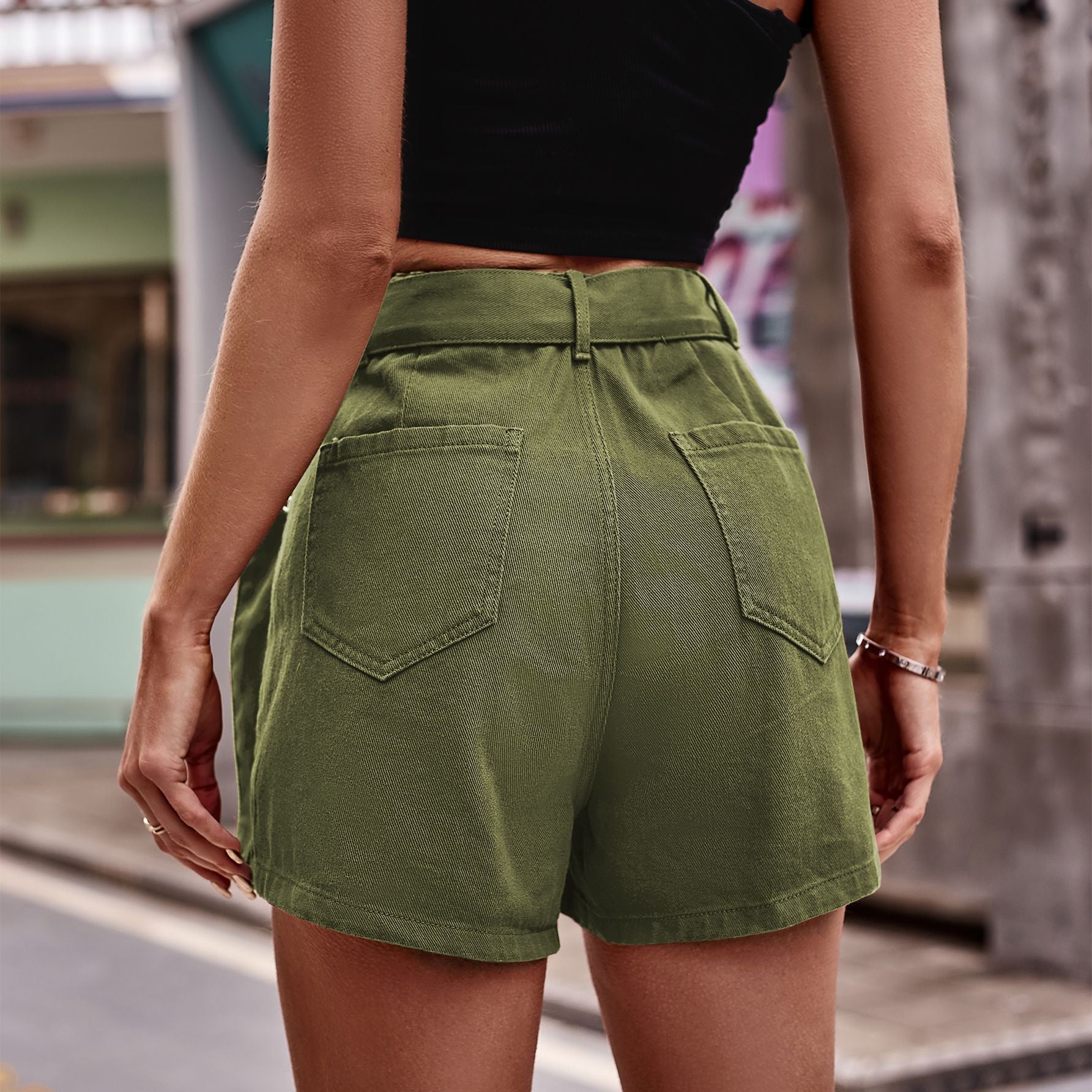Solid belted denim shorts with pockets.