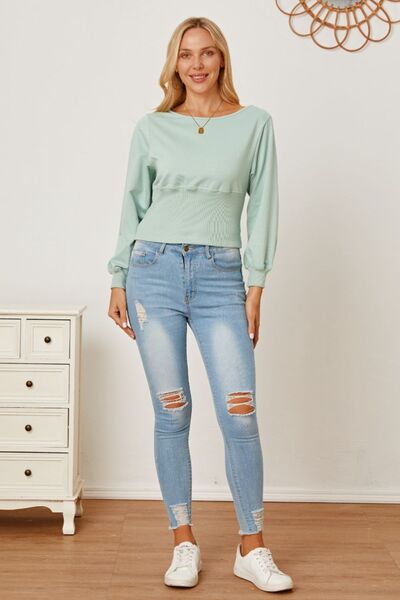 Boat neck lantern sleeve blouse.