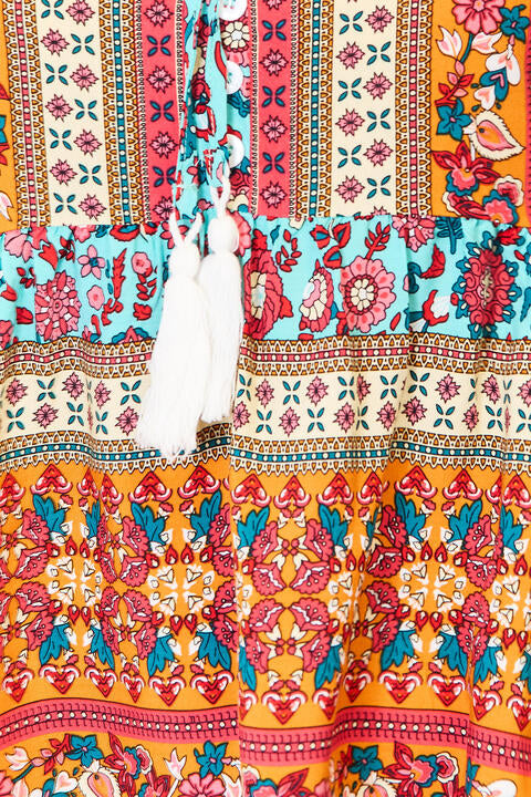 Devine bohemian tassel tie puff sleeve babydoll blouse.