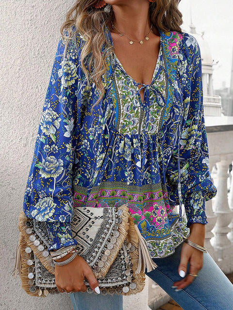 Devine bohemian tie neck lantern sleeve blouse.