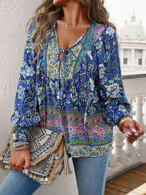 Devine bohemian tie neck lantern sleeve blouse.