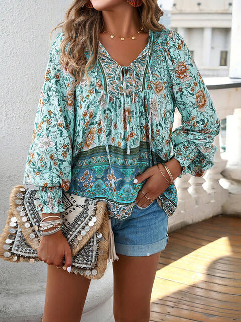 Devine bohemian tie neck lantern sleeve blouse.