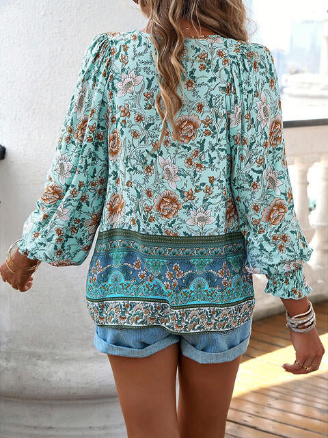 Devine bohemian tie neck lantern sleeve blouse.