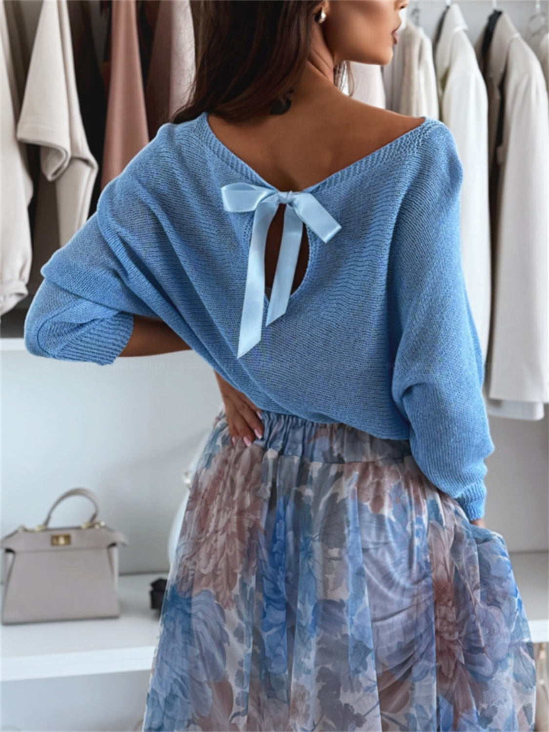 Bow back boat neck batwing sleeve sweater.