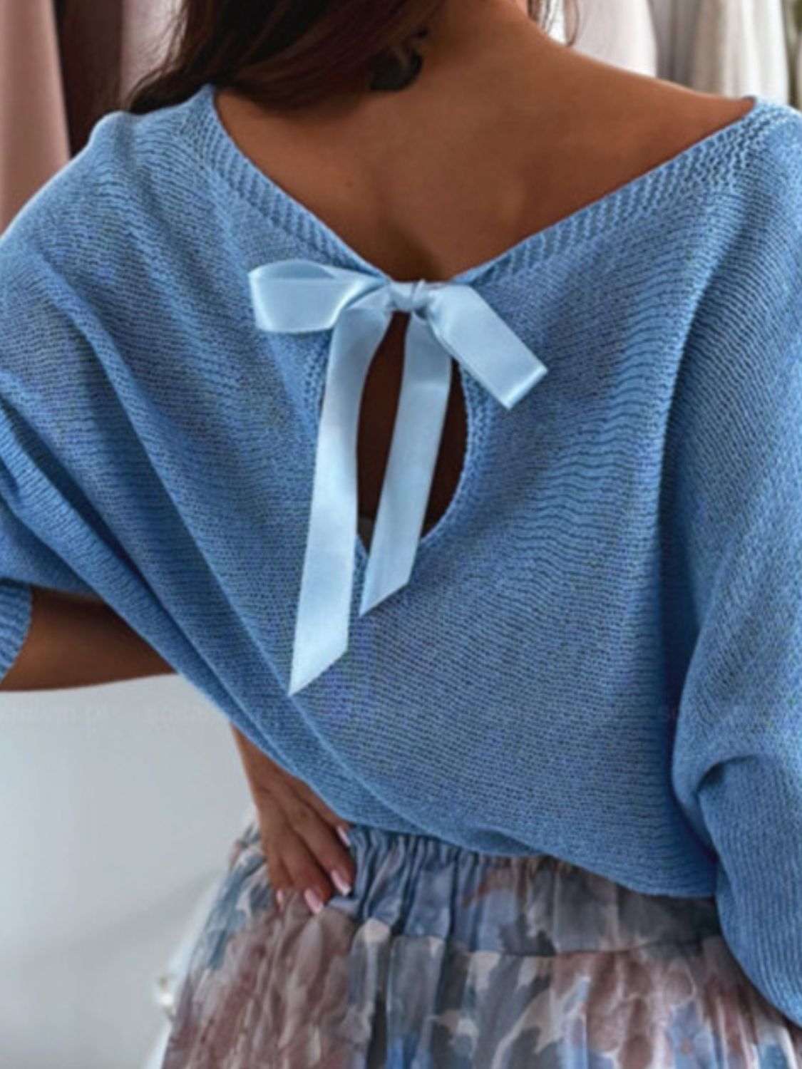 Bow back boat neck batwing sleeve sweater.